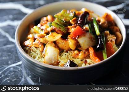 Chinese noodles with chicken and peanuts - Chinese cuisine food