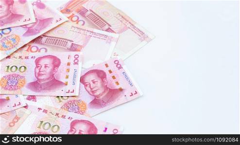 Chinese paper currency Yuan renminbi bill banknotes on white background, Banknote one hundred yuan, More chinese yuan background, China or economy of Asia growth, US trade war concept.