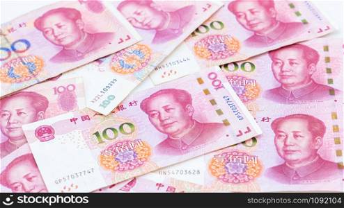 Chinese paper currency Yuan renminbi bill banknotes on white background, Banknote one hundred yuan, More chinese yuan background, China or economy of Asia growth, US trade war concept.