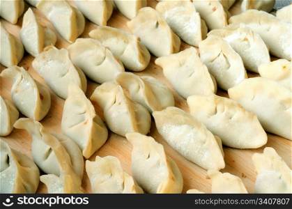 Chinese raw dumplings ready for being boiled
