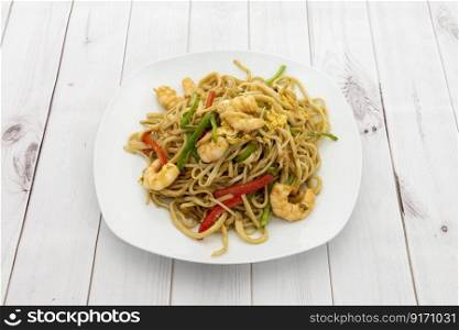 Chinese restaurant noodles sauteed with shrimp, vegetables, braised egg, and red and green peppers
