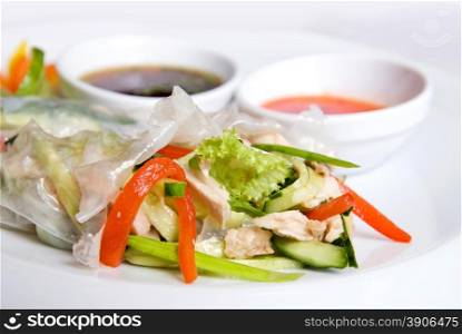 chinese rolls with vegetables on the plate