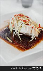 Chinese style steamed Snapper filet fish with sesame oil soy sauce and spring onion, ginger, chili.