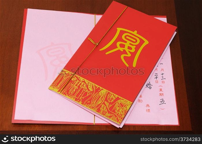 Chinese wedding invitation cards on the table