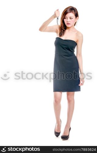 Chinese woman in a black dress holding a knife