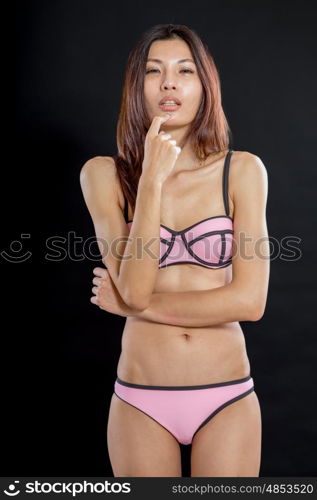 Chinese woman in lingerie on black background