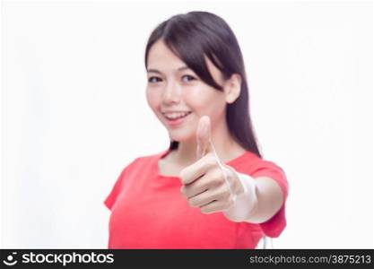 Chinese woman in red top with thumbs-up gesture