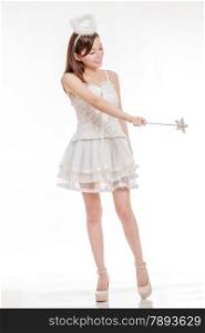 Chinese woman in white angel fairy costume poiting her wand
