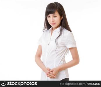 Chinese woman in white shirt and hands clasped looking at camera