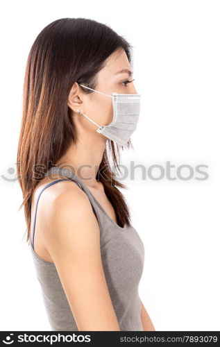 Chinese woman wearing surgical mask with white background, side profile