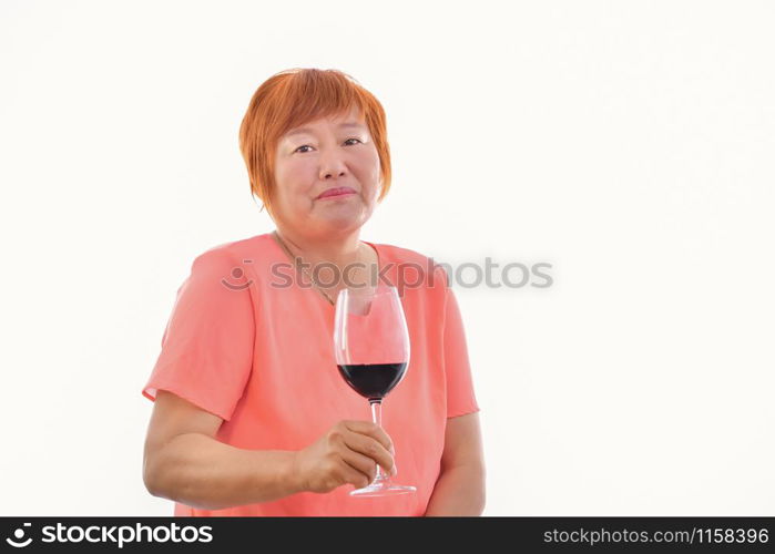 Chinese woman with a glass of red wine in her hand, on a light background.