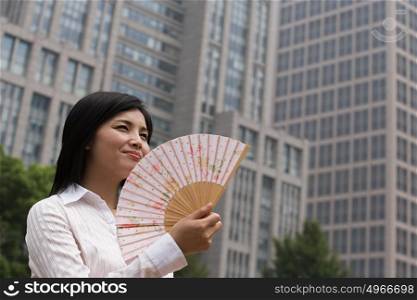 Chinese woman with a handfan