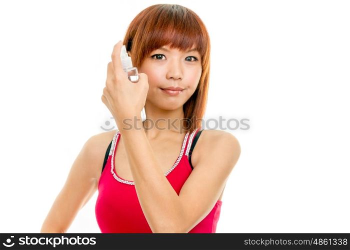 Chinese woman with spray bottle spraying hair