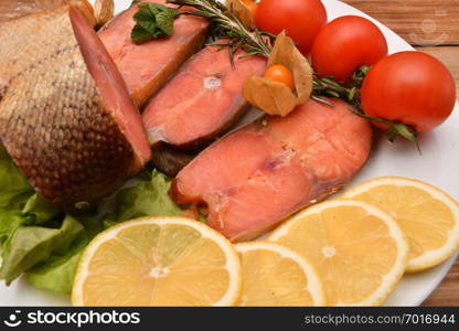 Chinook salmon (LAT. Oncorhynchus tshawytscha) smoked with fresh Greens and vegetables