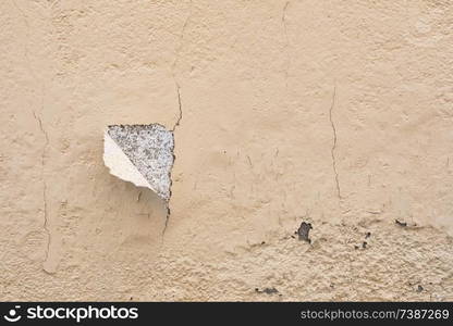 Chipped wall with a orange paing