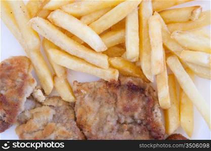 Chips and cooked pork fillets. Example of fast food