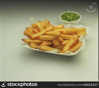 chips/fries in a takeaway tray