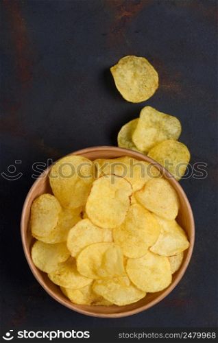 Chips in bowl on dark rustic table