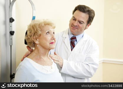 Chiropractic doctor treating an elderly patient for whiplash.