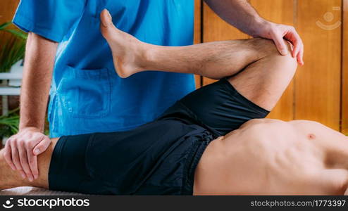 Chiropractic Manual Manipulation Spine Adjustment. Therapist treating patient&rsquo;s back. Discus Hernia or Herniated Disc Treatment.