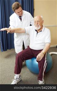 Chiropractor helping senior patient with physical therapy routine.