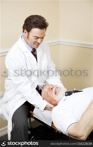 Chiropractor treats a senior man for neck pain.