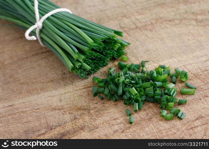 Chives on a wooden surface