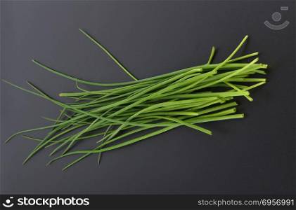 Chives on black background
