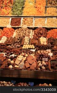 Choclates and pralines in all different sorts displayed on a Spanish market