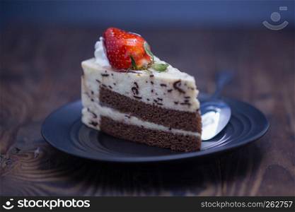 Chocolate and cheese cake on distressed wood background