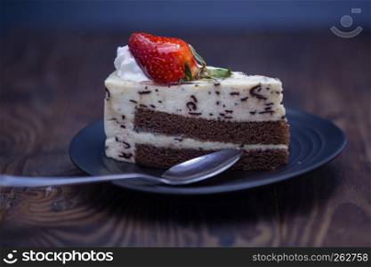 Chocolate and cheese cake on distressed wood background