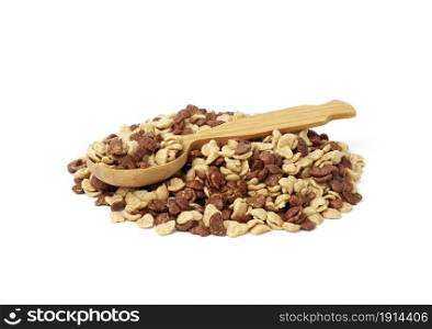 chocolate and honey cornflakes and a wooden spoon on a white background. Morning breakfast with milk