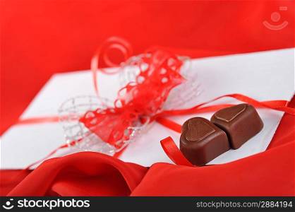chocolate and letter on red close up