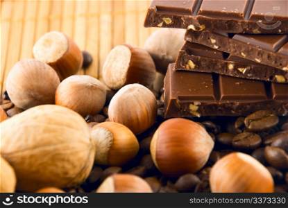 chocolate and nuts on a bamboo mat
