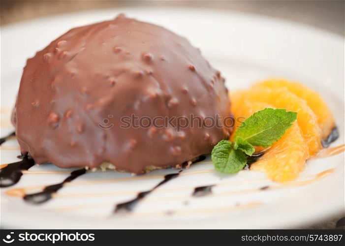 chocolate and orange croissant of mousse and almond cookies. chocolate and orange croissant