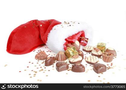 Chocolate and santa hat on a white background