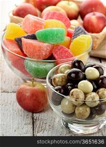 Chocolate Balls And Fruit Candies With Apples