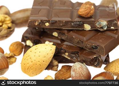 chocolate bar and nuts isolated on white