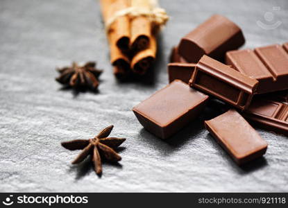 Chocolate bar and spice on dark background candy sweet dessert for snack , selective focus