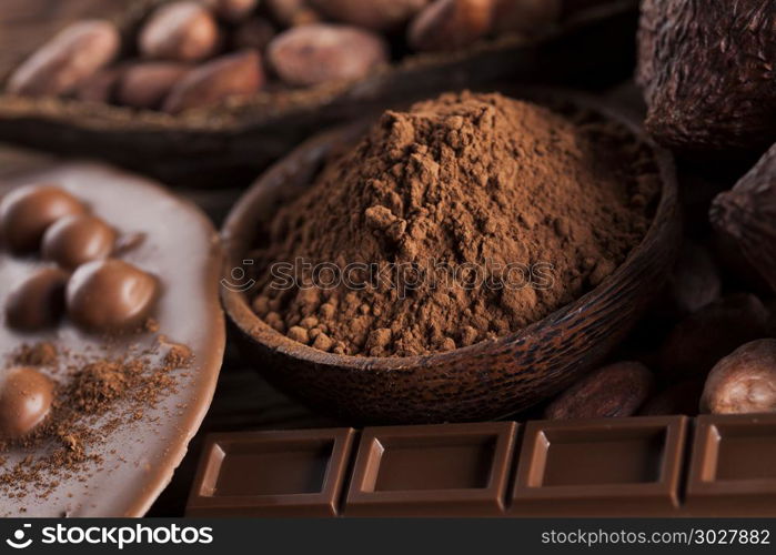 Chocolate bar, candy sweet, dessert food on wooden background. Aromatic cocoa and chocolate on wooden background