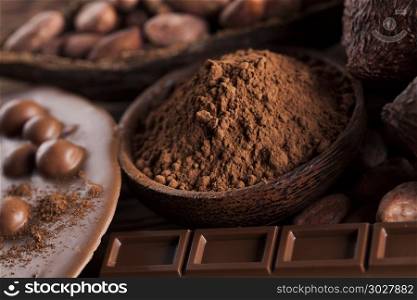 Chocolate bar, candy sweet, dessert food on wooden background. Aromatic cocoa and chocolate on wooden background