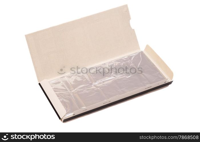 chocolate bar in foil. isolated on white.