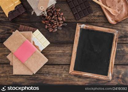 chocolate bar stack blank wooden slate cocoa beans powder table
