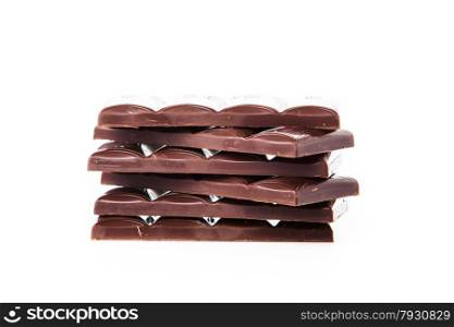 Chocolate bars stack isolated on white background. Chocolate blocks