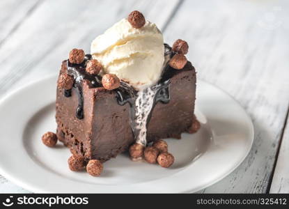 Chocolate brownie with vanilla ice cream and cocoa balls