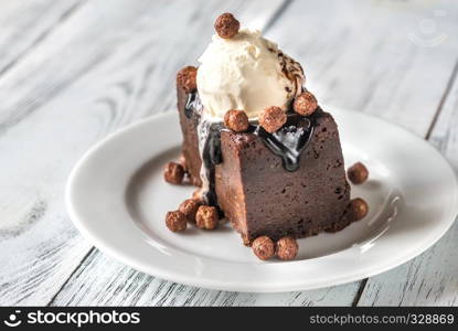 Chocolate brownie with vanilla ice cream and cocoa balls