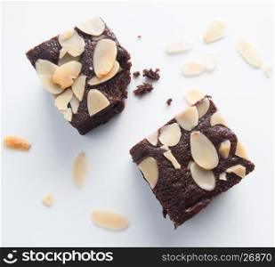Chocolate brownies, bitten off on white background