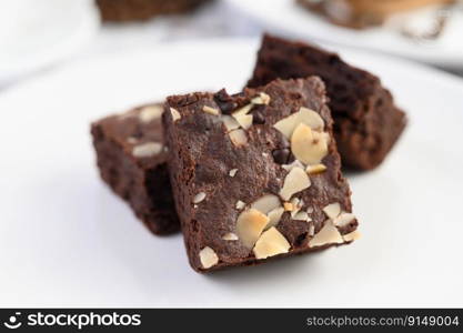 Chocolate brownies on a white plate. Selective focus.