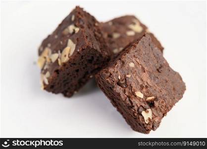 Chocolate brownies on a white plate. Selective focus.