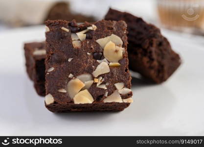 Chocolate brownies on a white plate. Selective focus.